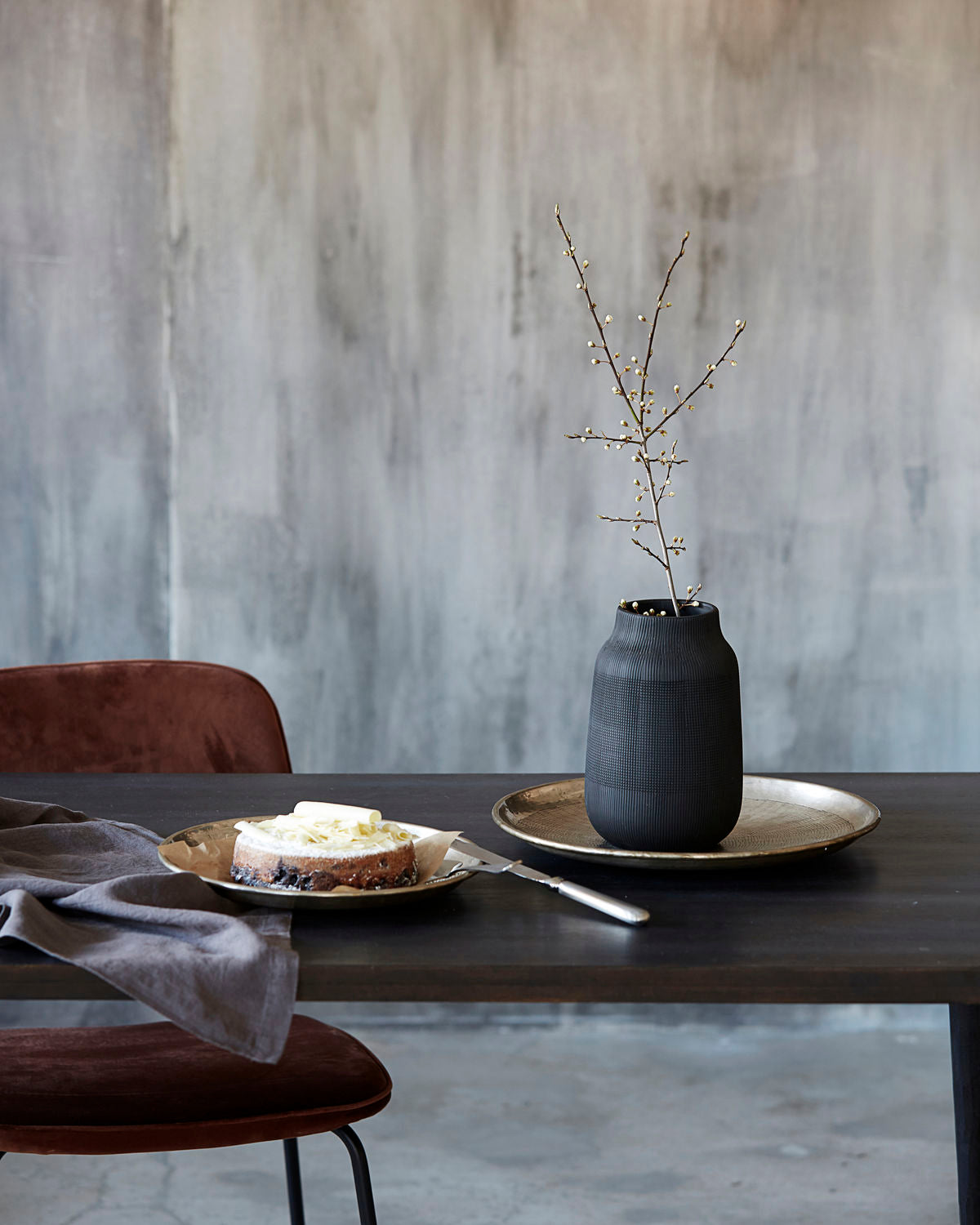 black etched vase on table